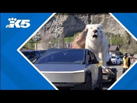 Giant snow lion, dinosaur end up on Washington ferry