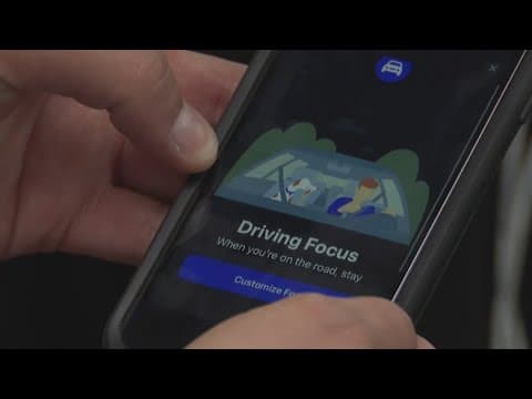 Driving school instructor encourages drivers to keep their phones down while on the road