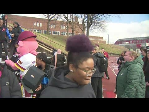Washington Commanders distribute girls flag football uniforms at McKinley Technology High School