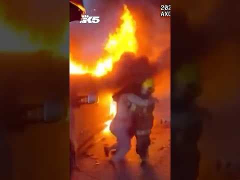 Tense video shows woman rescued from burning truck by off duty police officer and fireman