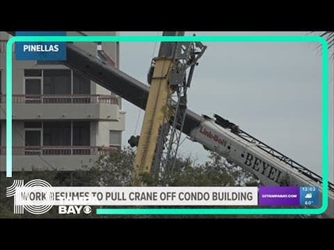 Work resumes to pull crane off condo building