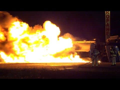 Raw video: 18-wheeler carrying around 8,800 gallons of unleaded fuel catches fire on North Freeway