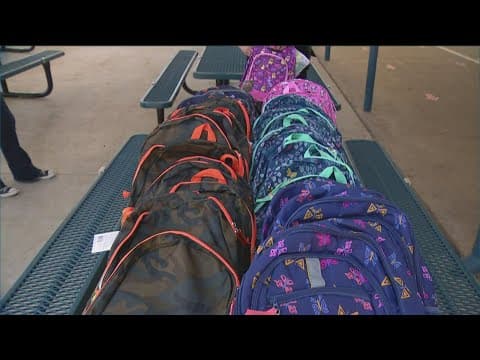 Dozens of students from EJE Academies surprised with new backpacks