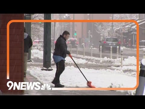 Wet, heavy snow falls into the Denver metro area