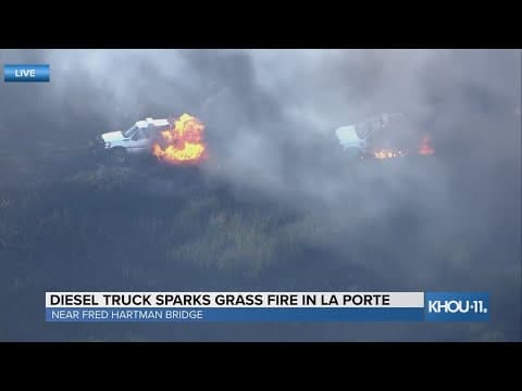 Trucks burn in fire near Fred Hardman Bridge