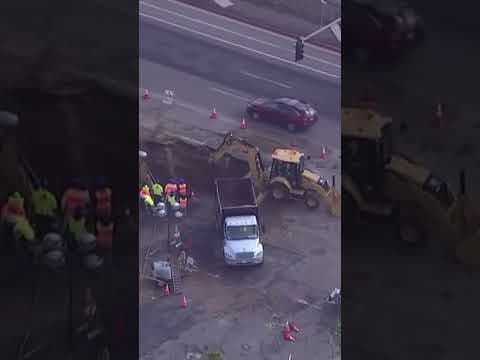 A sinkhole on Miramar Road near Dowdy Drive was several lanes wide and at least four feet deep.