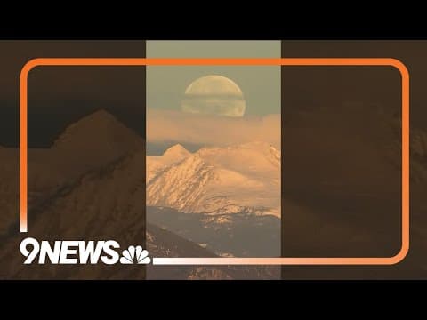 Wolf moon sets behind Colorado’s Rocky Mountains
