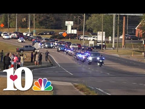Mourners pay their respect to fallen KCSO Deputy Tucker Blakely as he lies in repose