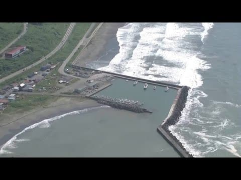 Aerials of coastline and boats in the Hokkaido prefecture of Japan during tsunami warning