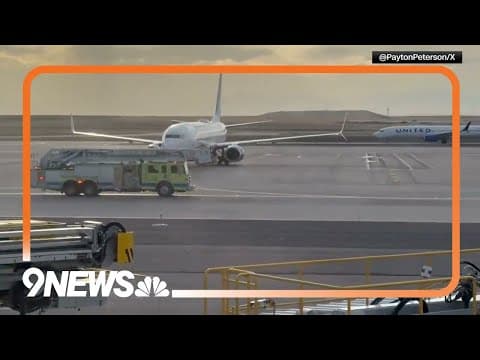Passengers Stand on Wing of American Airlines Plane During Engine Fire at Denver Airport