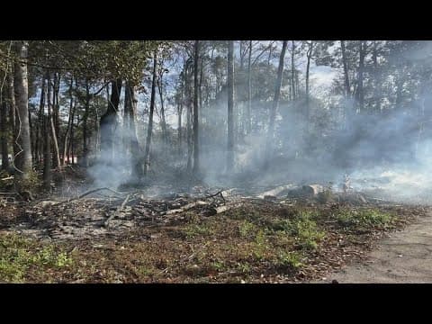 Slidell fire crews work to put out fire in the woods