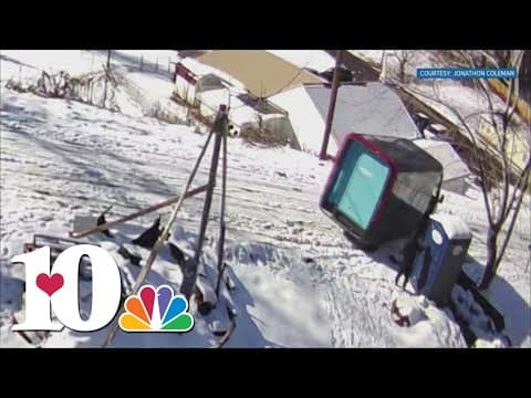 Amazon delivery van slides on icy slope and crashes into building; no injuries reported