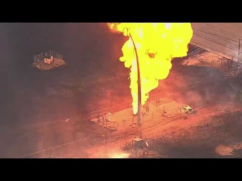 Families return to their homes after a pipeline fire caused major damage