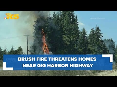 Brush fire threatens homes near busy Gig Harbor highway