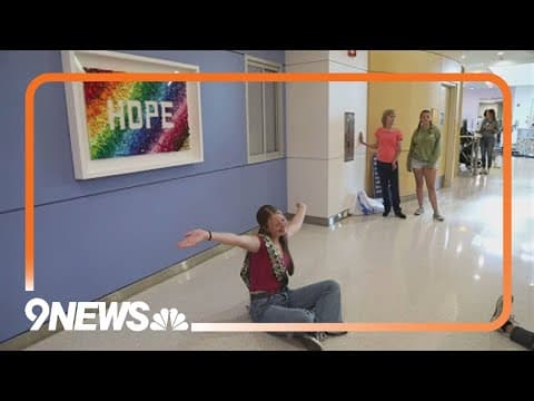 Girl unveils Lego 'Hope' sign at hospital that treated her cancer