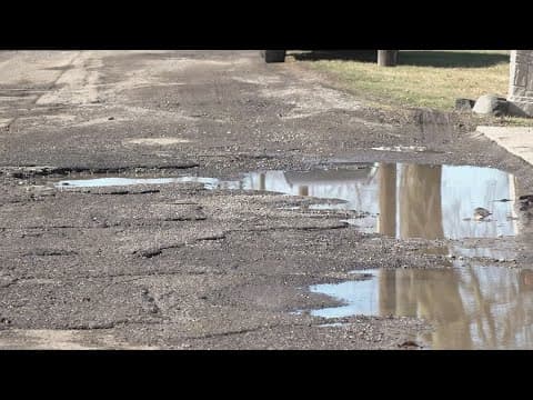Pothole-ridden Indy road costing drivers thousands of dollars and ruining some homeowners' property