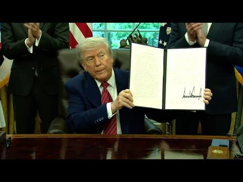 Donald Trump signs executive orders and answers questions from the press