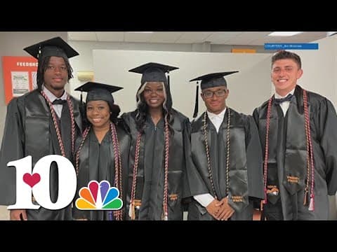 Tusculum University graduates walk across the stage