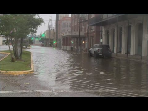 A closer look at rough surf, flooding along the Strand on Galveston Island