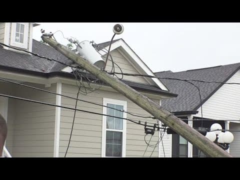 Power pole hangs over a home in Arabi after strong storms moved through the area