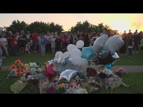 Child killed during school dismissal honored at community vigil