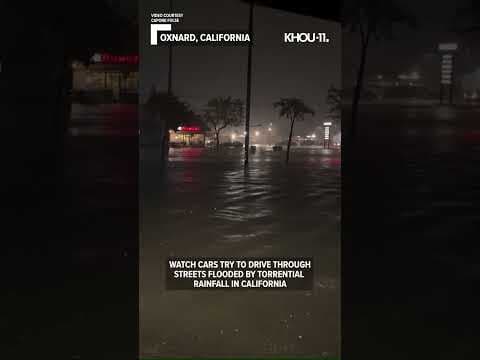 WATCH: Cars try to drive through streets flooded by heavy rain in California #shorts