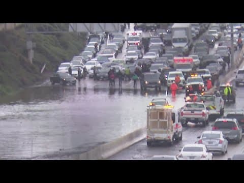 Almost all lanes open on I-15 northbound at Main Street after flooding stopped cars for hours