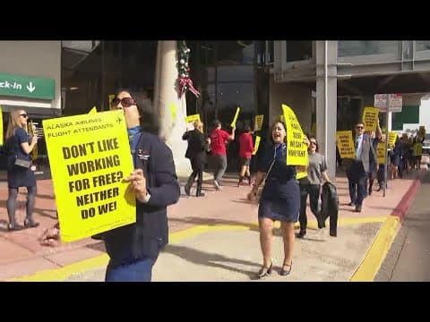 Alaska Airlines flight attendants demonstrate outside airport, will vote on strike authorization