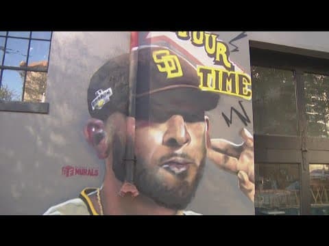 Fans prepare to cheer on the Padres ahead of Game 1 of the NLCS