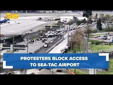 Protesters block road to Sea-Tac Airport