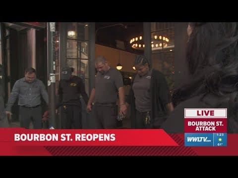 Bourbon Street workers hold an impromptu prayer