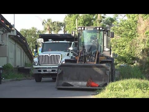Crews arrive to clear trash and debris at New Orleans encampment