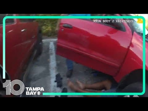 Florida police officers lift car off man after car jack fails