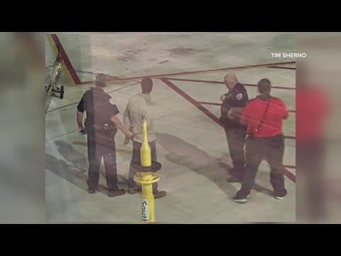 Passenger escapes through plane's emergeny exit while on tarmac