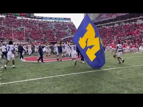 Michigan players plant team flag on Block O at midfield of Ohio Stadium | Ohio State vs Michigan