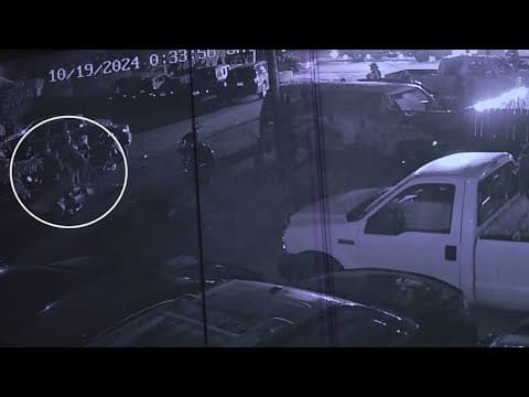 Security video shows aftermath from car driving into group of people in parking lot of Indy bar