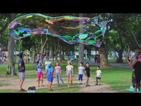 Meet the beachside bubble blower spreading joy, hope despite adversity