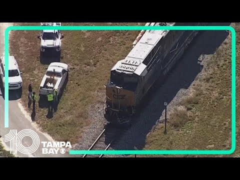 1 dead after dump truck and train collide, burst into flames, Hillsborough officials say