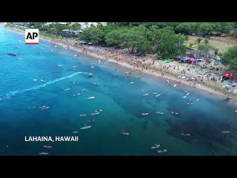 Maui remembers the 102 lost in the Lahaina wildfire with a paddle out 1 year after devastating blaze