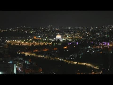 Iran says it fired dozens of missiles into Israel, where residents are warned to shelter in place