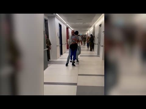 9-year-old former Israeli hostage runs to hug father after being freed in swap