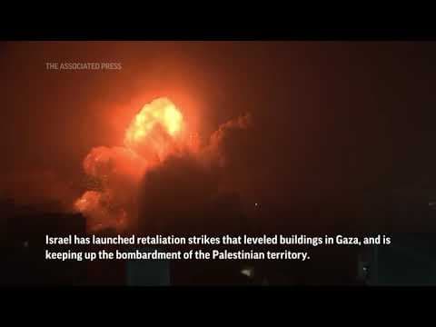 Israel battles Hamas for a second day after mass incursion, trades fire with Lebanon’s Hezbollah