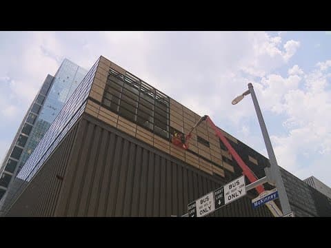 Downtown Houston storm recovery efforts continue as broken glass still litters streets
