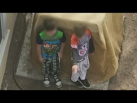 Deputies try to get two boys, ages 9 and 7, to drop gun