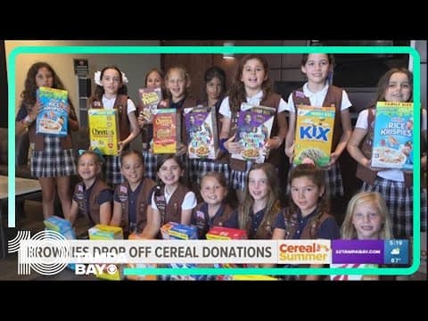 Girl Scout Brownies drop off cereal donations for Cereal for Summer