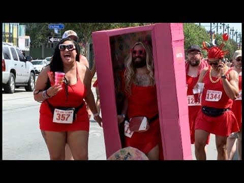 Red Dress Run rolls down Rampart Street