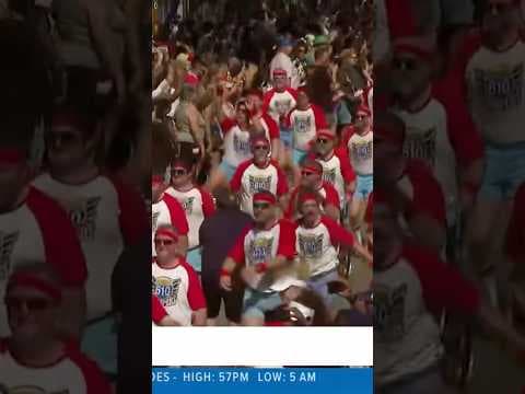 The famous 610 Stompers dance their way down the streets of New Orleans at Super Bowl parade.