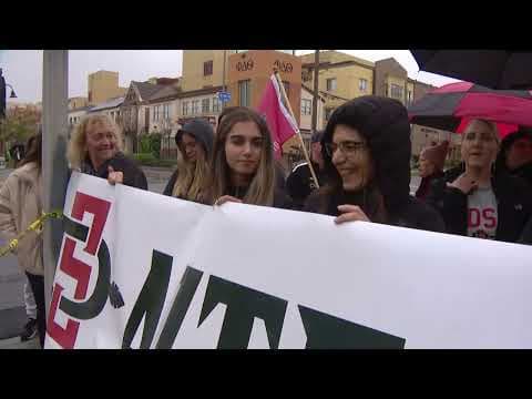 The Aztecs are loading onto buses to take them to the airport as fans cheer them on