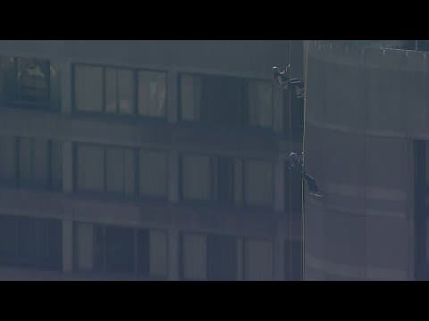 United Way raising money by rappelling people down side of 26-story building