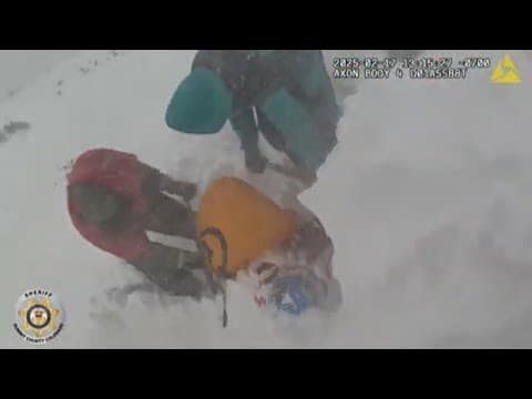 Video shows rescue of snowmobiler buried under nearly 2 feet of snow
